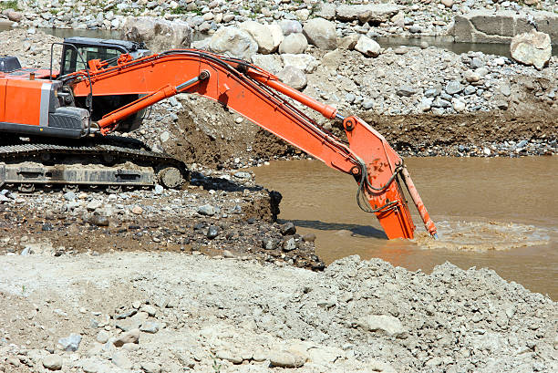 Excavator digging a trench